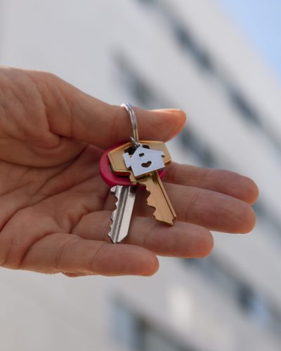 hand-holding-keys-outdoors